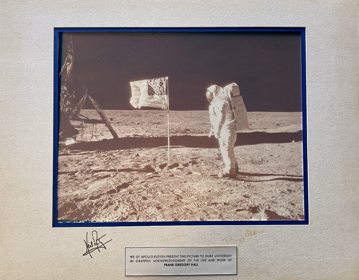 Photograph of Apollo 11 astronaut on the Moon with the signatures of all three Apollo 11 astronauts on the mat board: Neil Armstrong, Michael Collins, and Edwin “Buzz” Aldrin