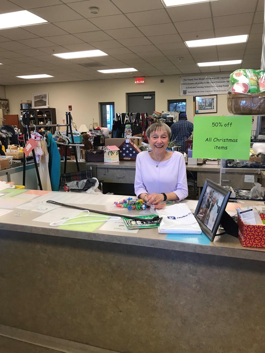 current Chair Virginia Brown Lang at the checkout counter